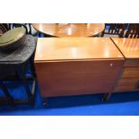 A vintage teak trolley table having drop leaf to one side, width approx 84cxm, open depth 92cm,