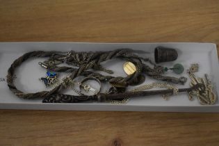 An assorted collection of silver and white metal, including a rope twist chain, button hook with