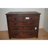 A 19th oak apprentice miniature chest of drawers, having two short and three long drawers, knob