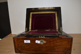 A Victorian walnut and geometric inlaid writing slope, having a mother of pearl lozenge to the