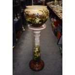 A late 19th Century Leeds pottery jardiniere on stand, in the aesthetic design, having a shaded