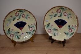 Two Victorian Majolica plates, having moulded decoration of basket weave, with fan to centre, bees