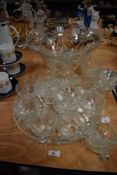 A cut glass punch bowl set with ladle and cups