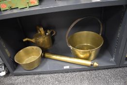 A 19th Century brass preserve pan, a country house brass watering can, a cooking pot, and a