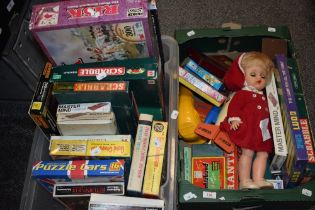An assortment of vintage board games including Scrabble, Ludo, Master mind and a set of Draughts,