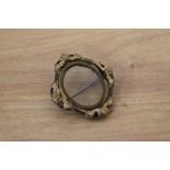 A Victorian swivel frame picture brooch in gold tone metal, with pin fastening.