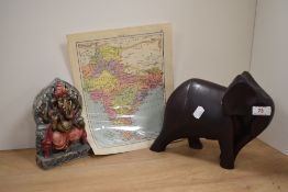 A contemporary resin sculpture of a stylised elephant, measuring 22cm tall, an ethnic and painted