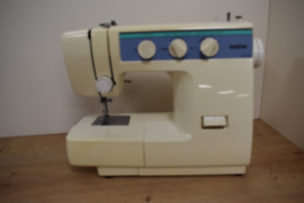 A vintage Brother VX 1300 sewing machine and manual.