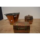 A vintage copper and brass pail, together with a textured copper tea caddy, and a barrel form