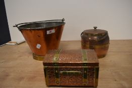 A vintage copper and brass pail, together with a textured copper tea caddy, and a barrel form