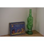 An interesting moulded green glass wine bottle, in the form on a hand, measuring 36cm tall, and a