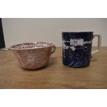 Two oversized Victorian cups, one with blue pagoda and willow transfer pattern, the other in red