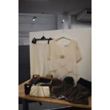 A Gina Bacconi skirt and top, faux fur wrap, and a box of ladies bags