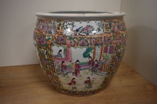 A 20th Century Chinese polychrome fish bowl, famille rose, decorated with repeating floral and