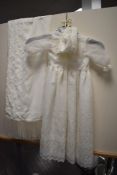 A christening gown, hat, and shawl