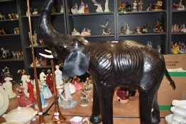 A large Libertys leather clad elephant study, with tooled detail.