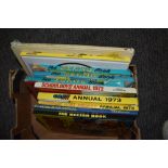 A box of vintage 1970s and other children's annuals including The Beano, The Beezer, and Bambi