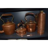 Two 19th Century copper and brass kettles, a smaller kettle, and a ribbed Tala copper flask