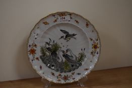 A 20th century plate, having moulded stork and goose decoration,possibly Bavarian or similar.
