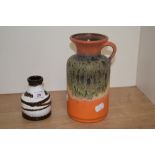 Two mid-century West German pottery vases, the largest with orange glaze and measuring 20cm tall