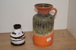 Two mid-century West German pottery vases, the largest with orange glaze and measuring 20cm tall
