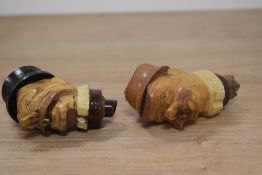 Two vintage German carved bottle stoppers.