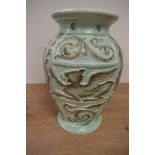 A moulded mint green Burleigh Ware vase, having Griffin and foliate decoration.