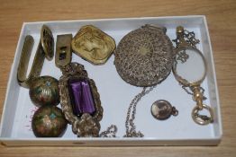 An assorted collection of white metal jewellery, including a filigree locket on chain, a Cloisonne