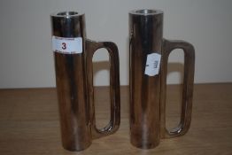 A pair of industrial design metal candlesticks, stamped to the handles 'Arik Levy' (b.1963, Israel),