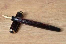A Parker Major Long Vacumatic in burgundy with single broad band to the cap having Parker 14k nib.