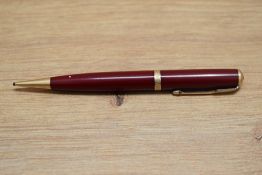 A Parker Duofold propelling pencil in red with decorative band