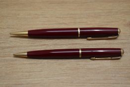 Two Parker Duofold propelling pencils in red with decorative band