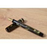 A Parker Duofold Moderne button fill fountain pen in sea green pearl and black with one broad and