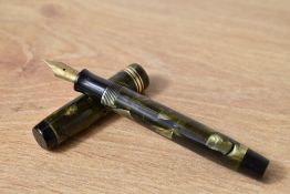 A Parker Duofold Moderne button fill fountain pen in sea green pearl and black with one broad and