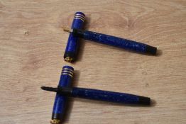 Two Parker Lady Duofold Lucky Curve button fountain pen in Lapis Blue with three narrow a ring cap
