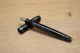 A Parker Vacumatic fountain pen in green pearl with three narrow bands to the cap having Parker