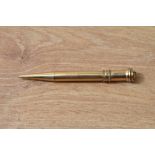 A Parker Duofold Vest Pocket propelling pencil in gold fill and ring top