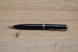 A Parker Vacumatic propelling pencil in black with three narrow bands. Engraved