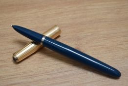 A Parker 51 aero fill fountain pen in teal blue with rolled gold cap