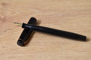 A Parker Ladys button fill fountain pen in black chaised design having warrented 14ct 1st quality