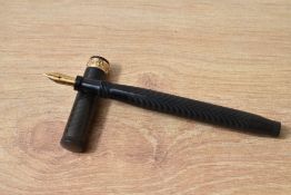 A Parker Lucky Curve button fill fountain pen in BHR with a decorative gold bands to the cap
