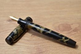 A Parker Victory button fill fountain pen in olive green and black with single band to the cap