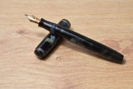 A Parker Premiere button fill fountain pen in black and grey marble with single narrow band to the