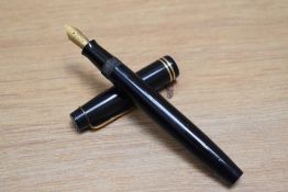 A Parker Victory button fill fountain pen in dark blue with two narrow bands to the cap having