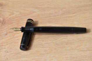 A Parker Ladys button fill fountain pen in black chaised design with two narrow bands to the cap