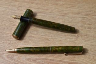 A Parker Moderne Duette Jr button fill fountain pen and propelling pencil set in green and gold