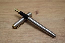A Parker Sonnet Flighter GT converter fill fountain pen in stainless steel with gold trim having
