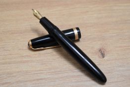 A Parker Duofold aerofill fountain pen and propelling pencil set in black with decorative broad band