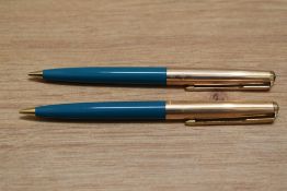 Two Parker 61 propelling pencils in turquoise with rolled gold caps