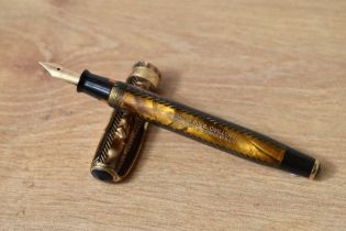 A Parker Royal Challenger Slender button fill fountain pen in gold and black herringbone with